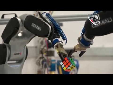 Solving The Rubik's Cube with Two Industrial Robots